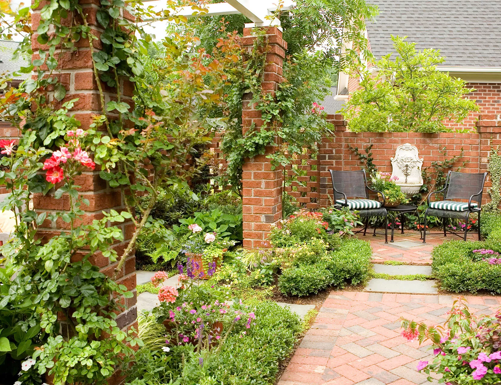 backyard brick patio with brick columns