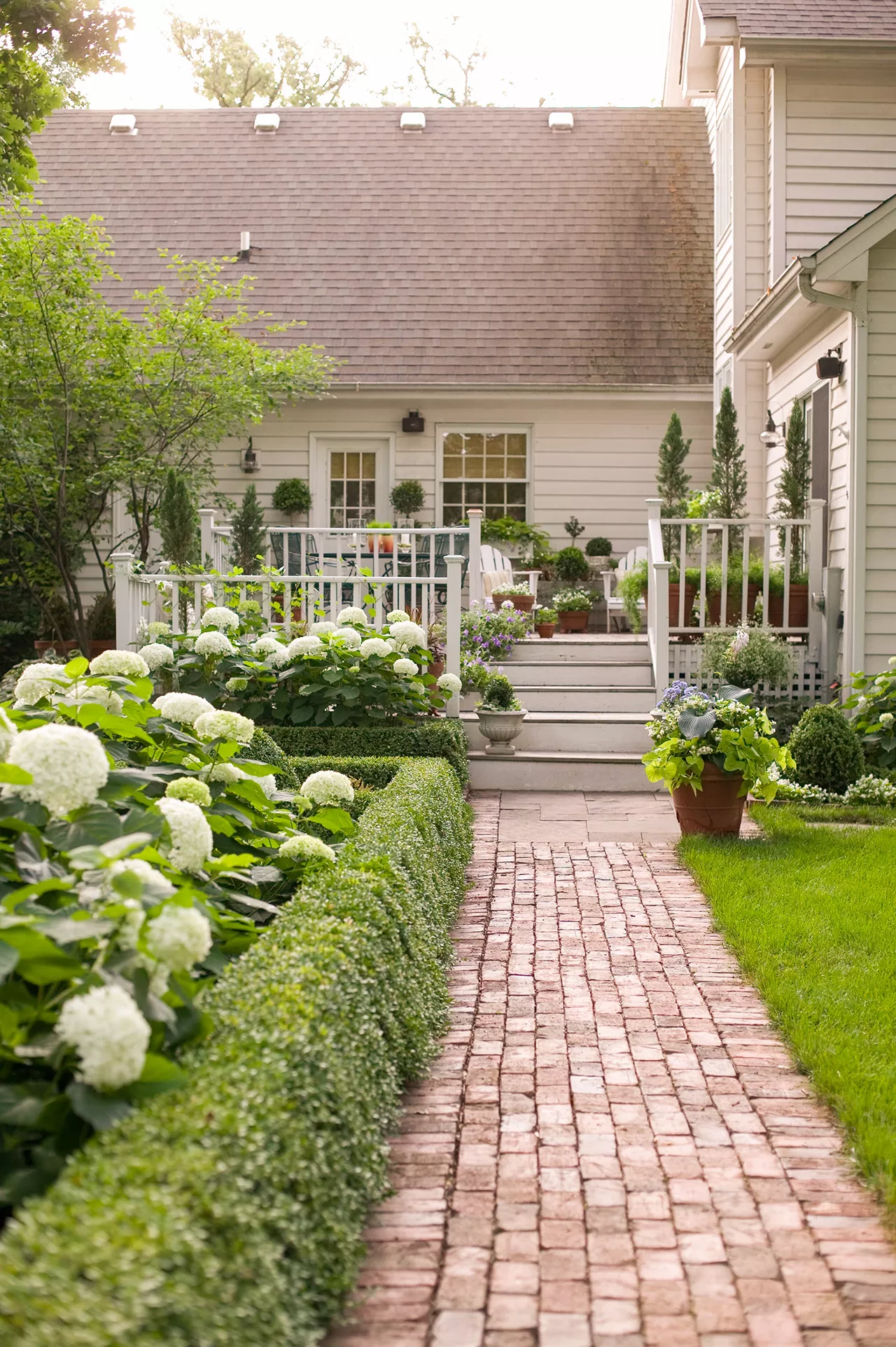 brick path along landscaping to home deck