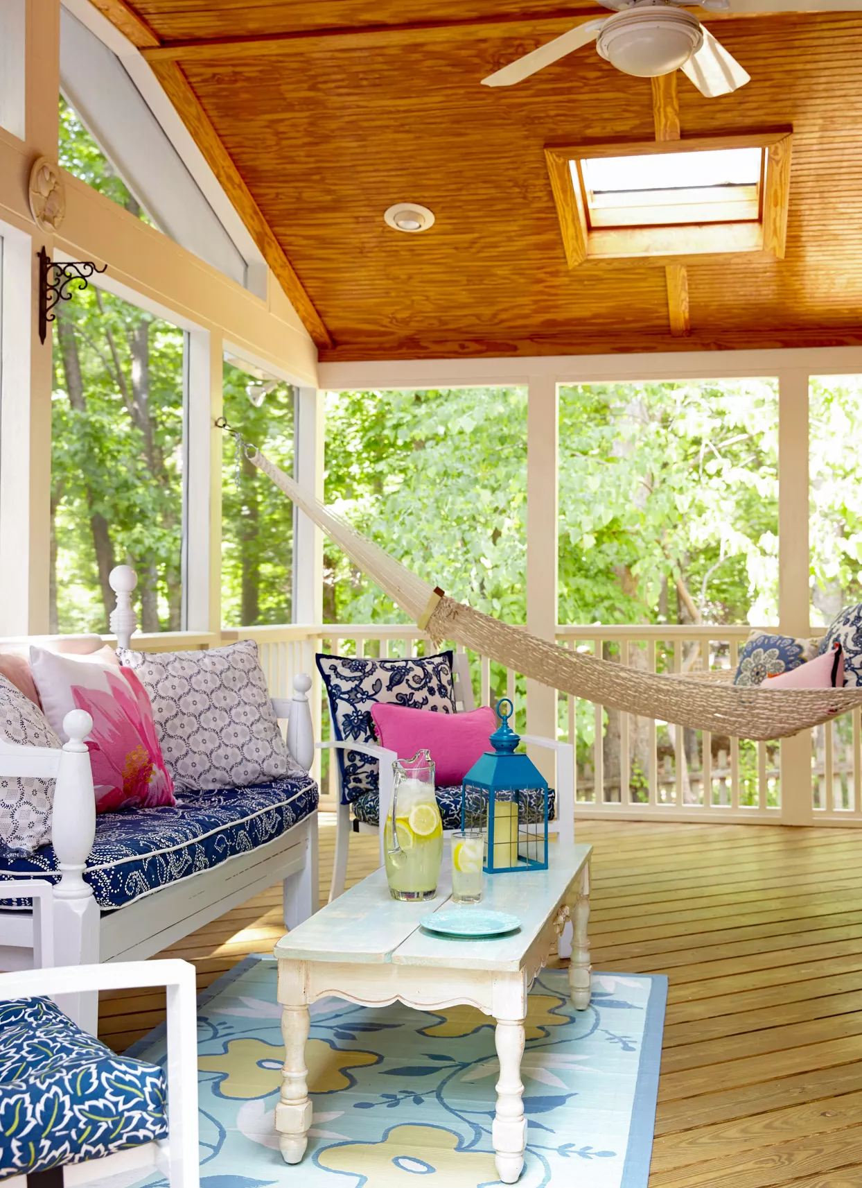 covered deck with hammock and patio furniture