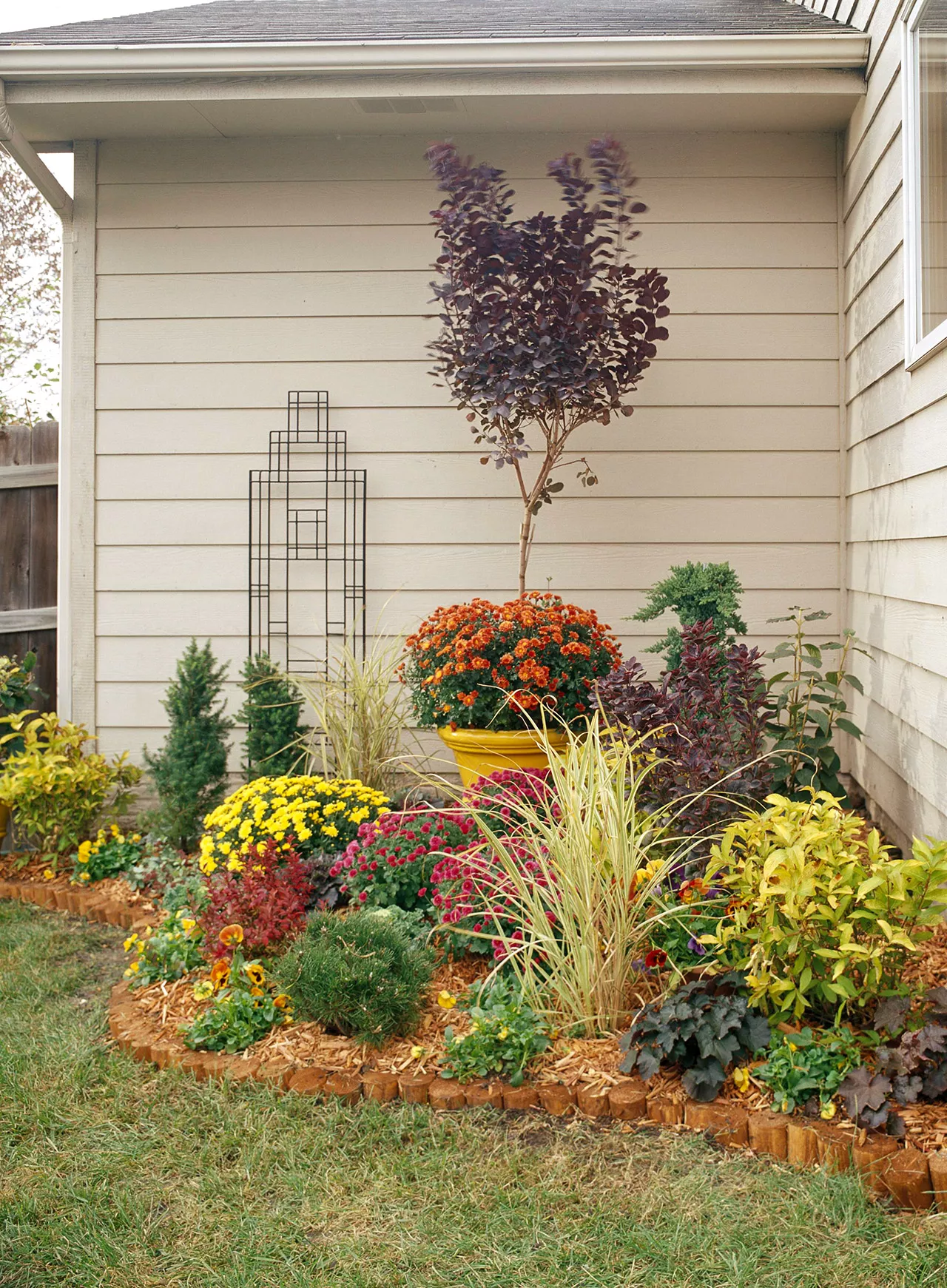 home exterior corner garden with flowers