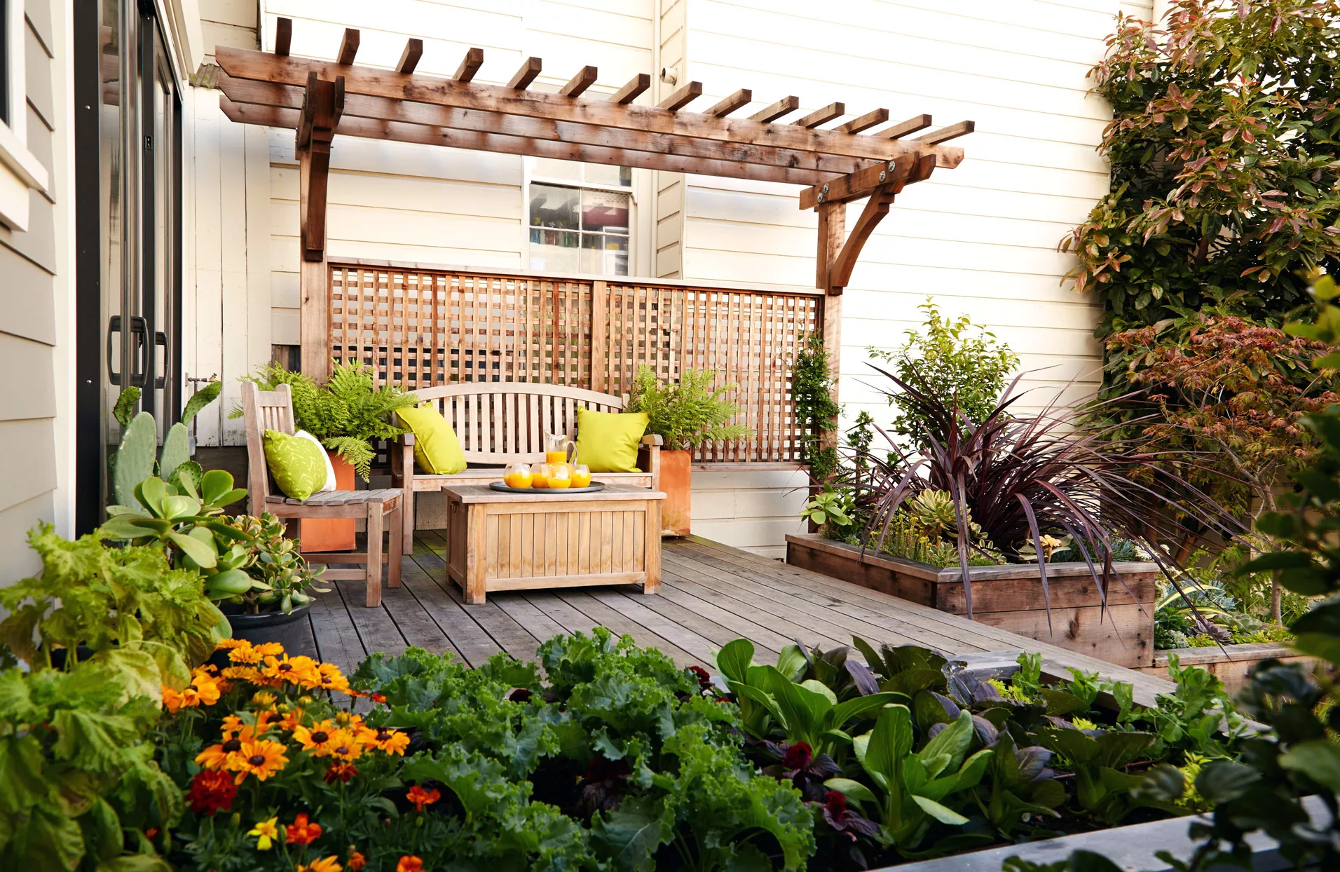 pergola on deck with trellis and wood patio furniture