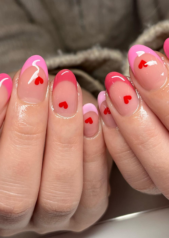 pink french tip nails with hearts