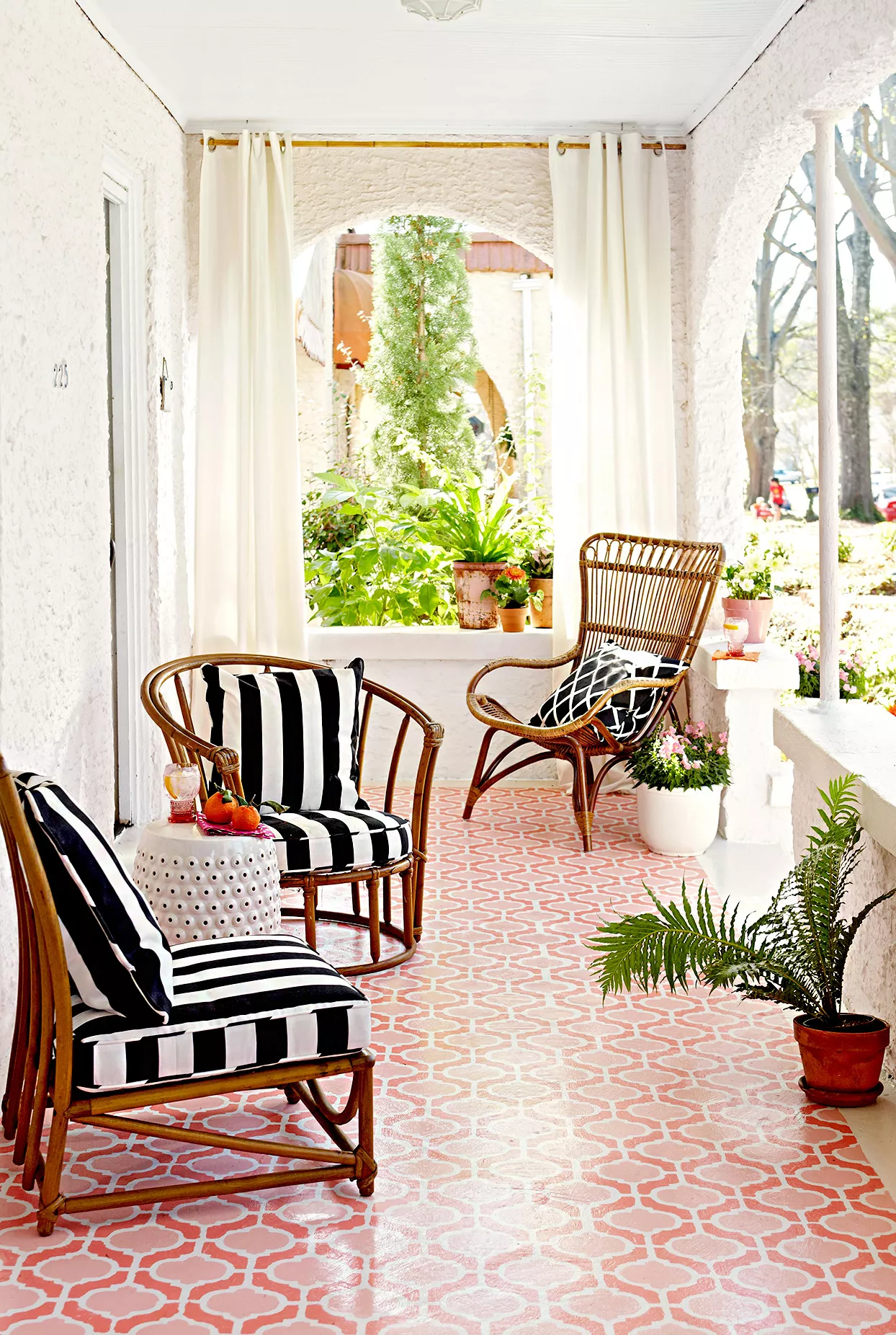 Porch with striped chairs, curtains