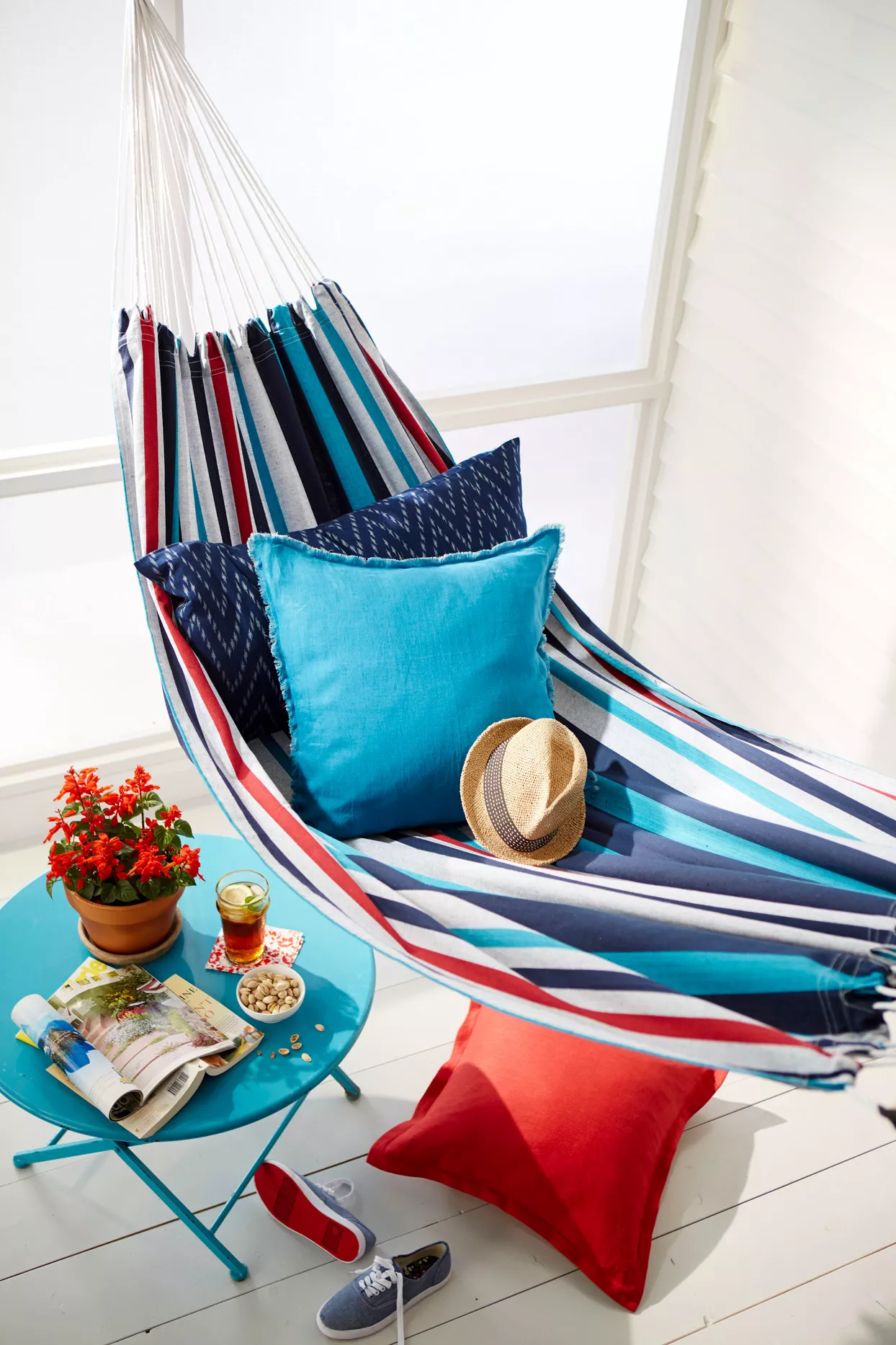 red, white, and blue striped hammock and mini table