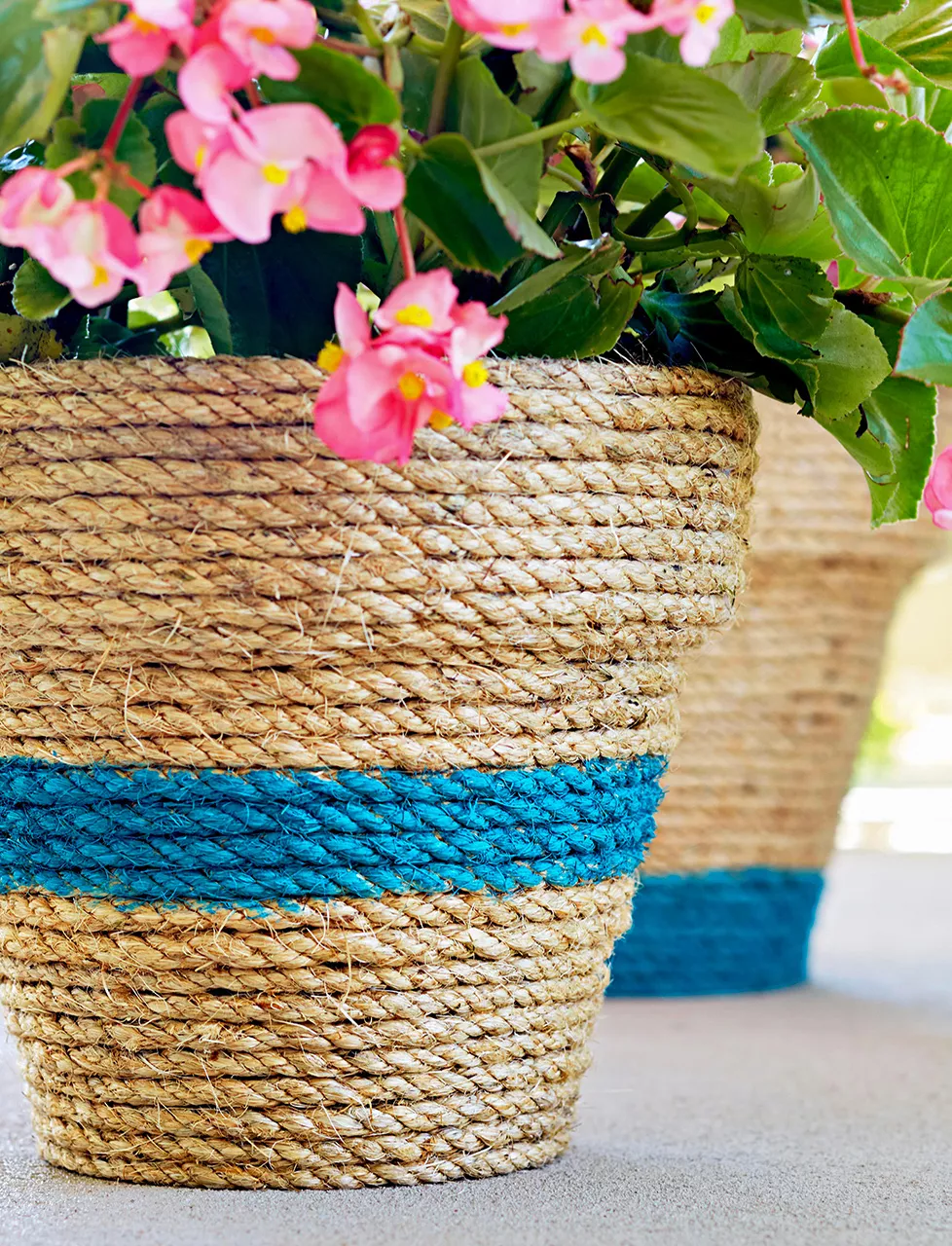 rope wrapped pot pink flowers