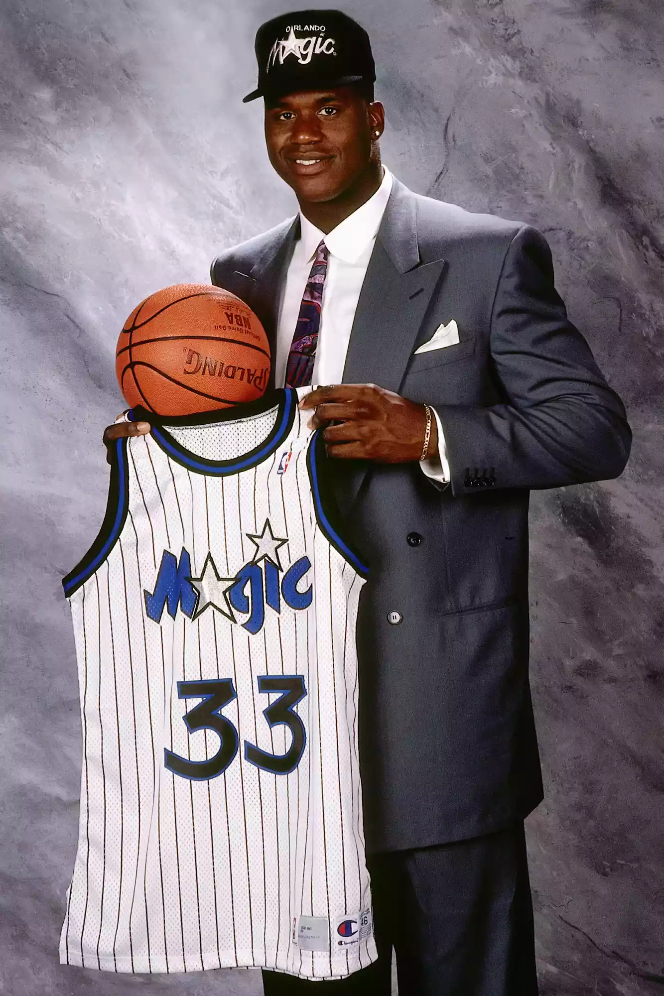 Shaquille O'Neal poses for a portrait with his #33 Orlando Magic jersey after being drafted by the Orlando Magic with the first overall pick of the 1992 NBA Draft.