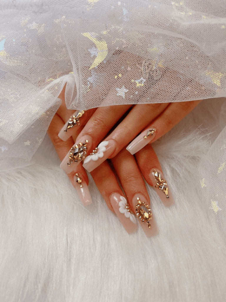 Obsessed with gold? This post will feature 99+ gold nail ideas that are foolproof gold nail designs that drip with luxury. Whether you’re getting ready for a wedding, party, birthday, or just want to feel like a million bucks, we’ve got the perfect gold nail design for you.