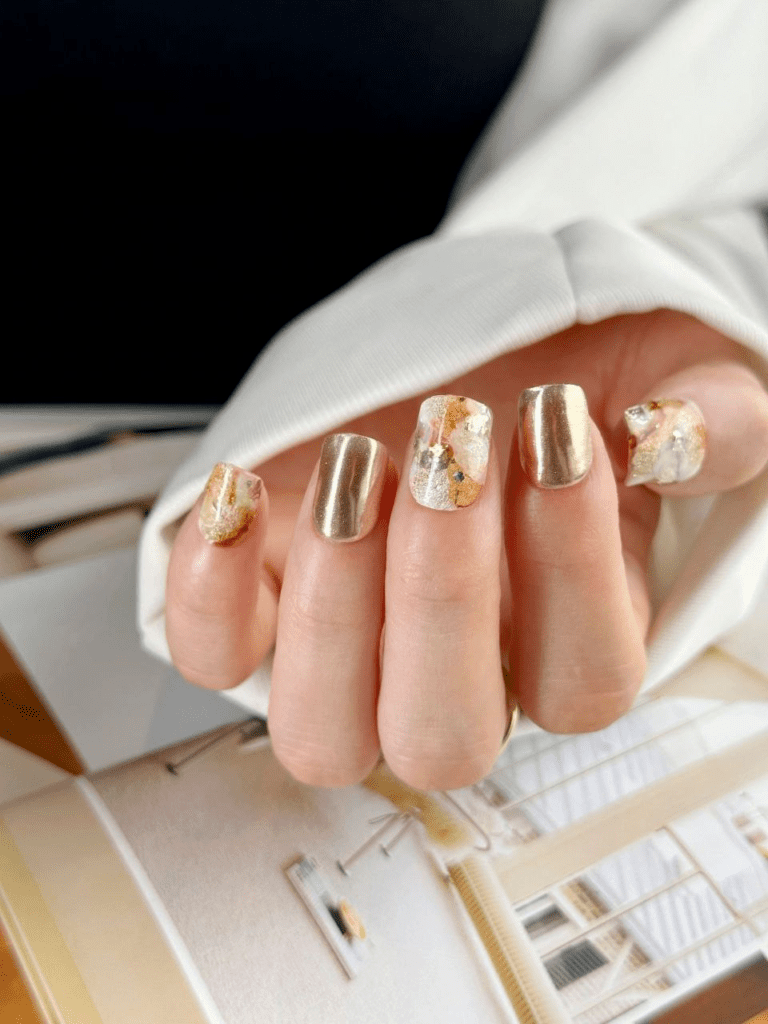 Obsessed with gold? This post will feature 99+ gold nail ideas that are foolproof gold nail designs that drip with luxury. Whether you’re getting ready for a wedding, party, birthday, or just want to feel like a million bucks, we’ve got the perfect gold nail design for you.