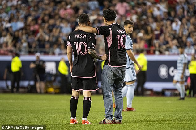 The fan reached Messi and appeared to try and take a selfie beforeYassine Cheuko intervened