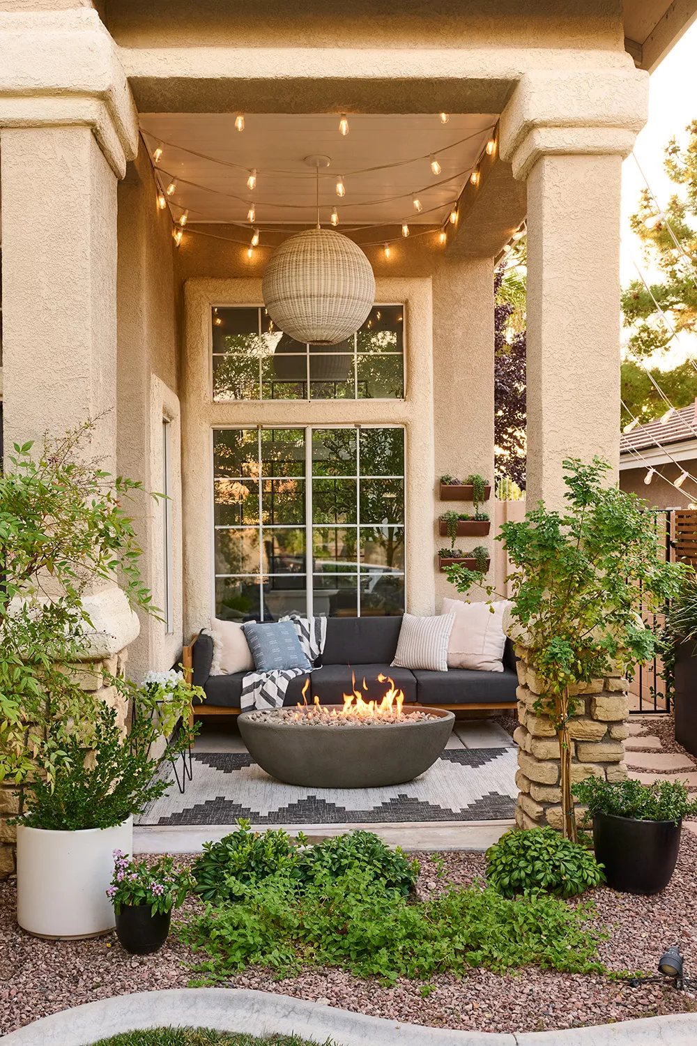 patio with string lights and fire pit