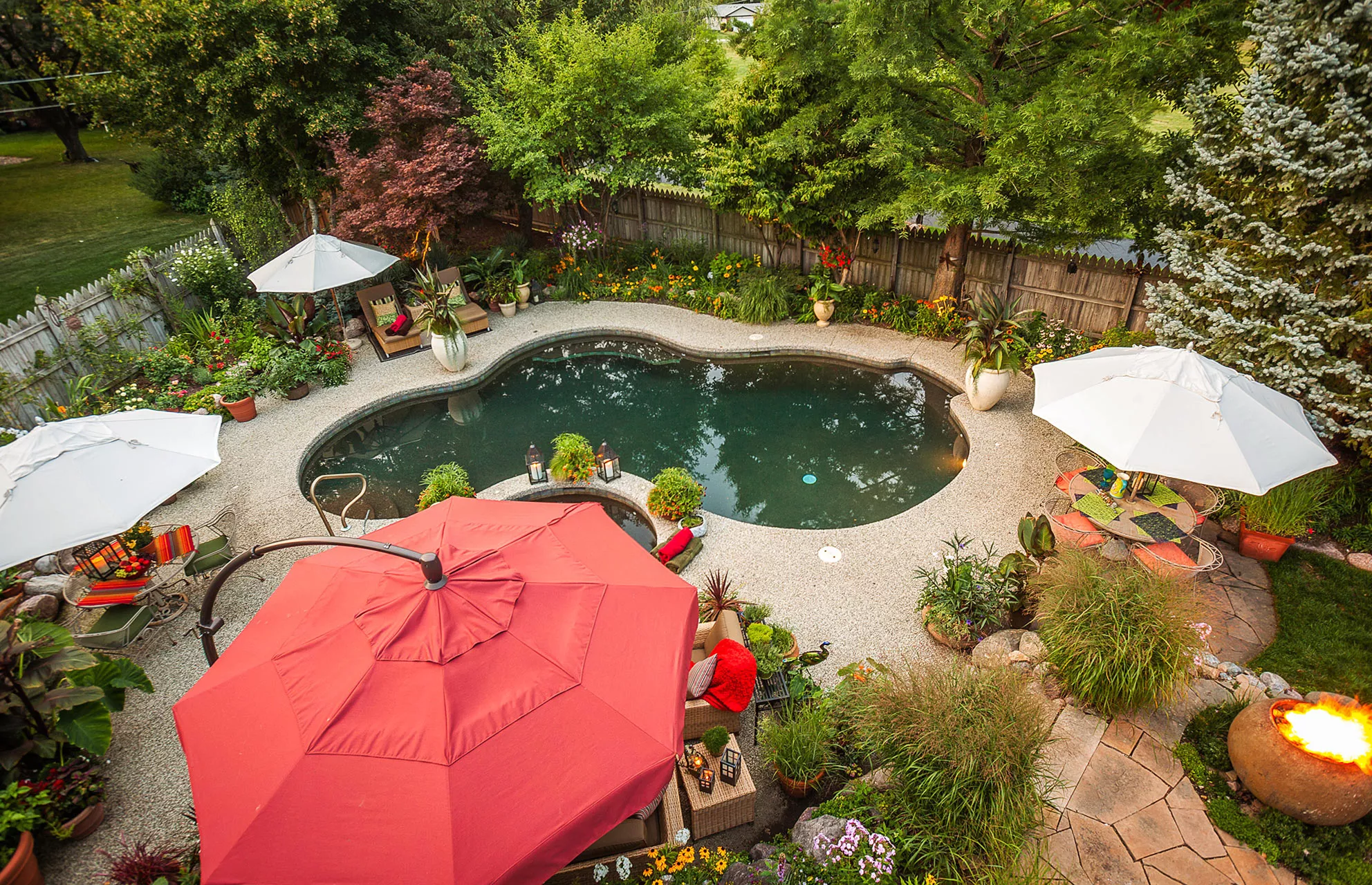 Elevated view of backyard with swimming pool and seating area