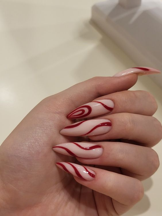  White Nails with Red Swirls