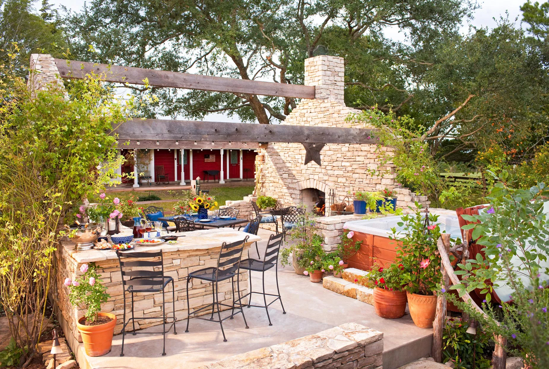 outdoor sitting area with stone fireplace