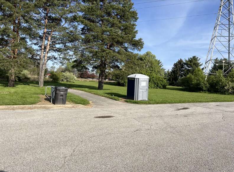 port-a-potty in field 