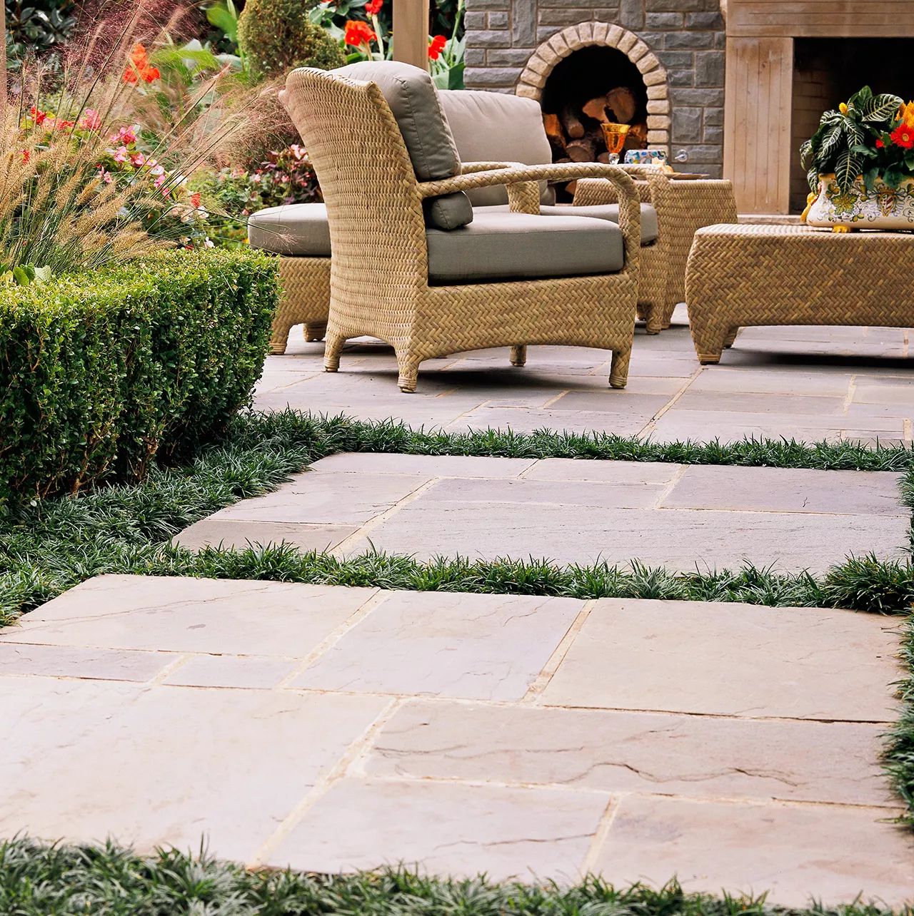 backyard stone patio with outdoor seating