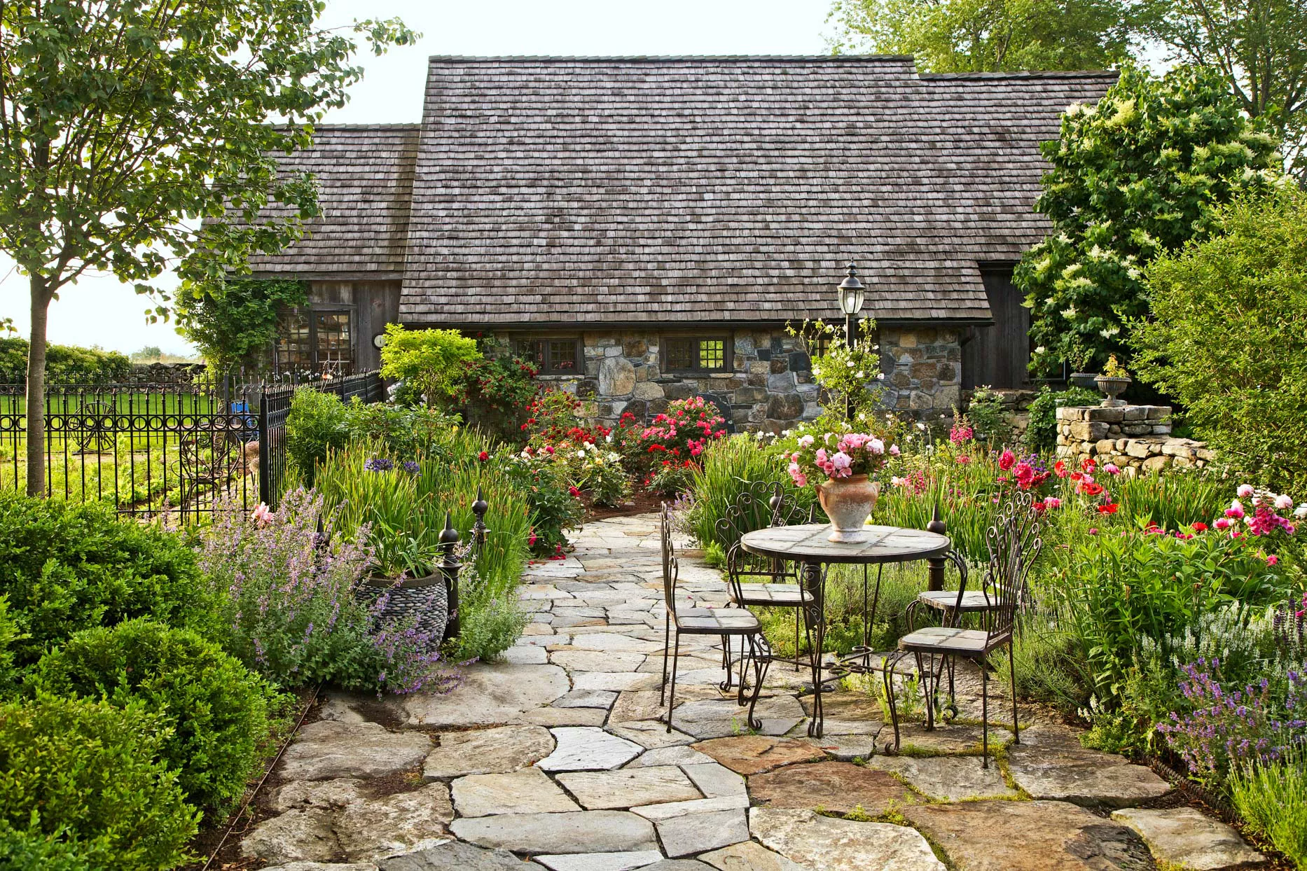 stone walkway with table and chairs