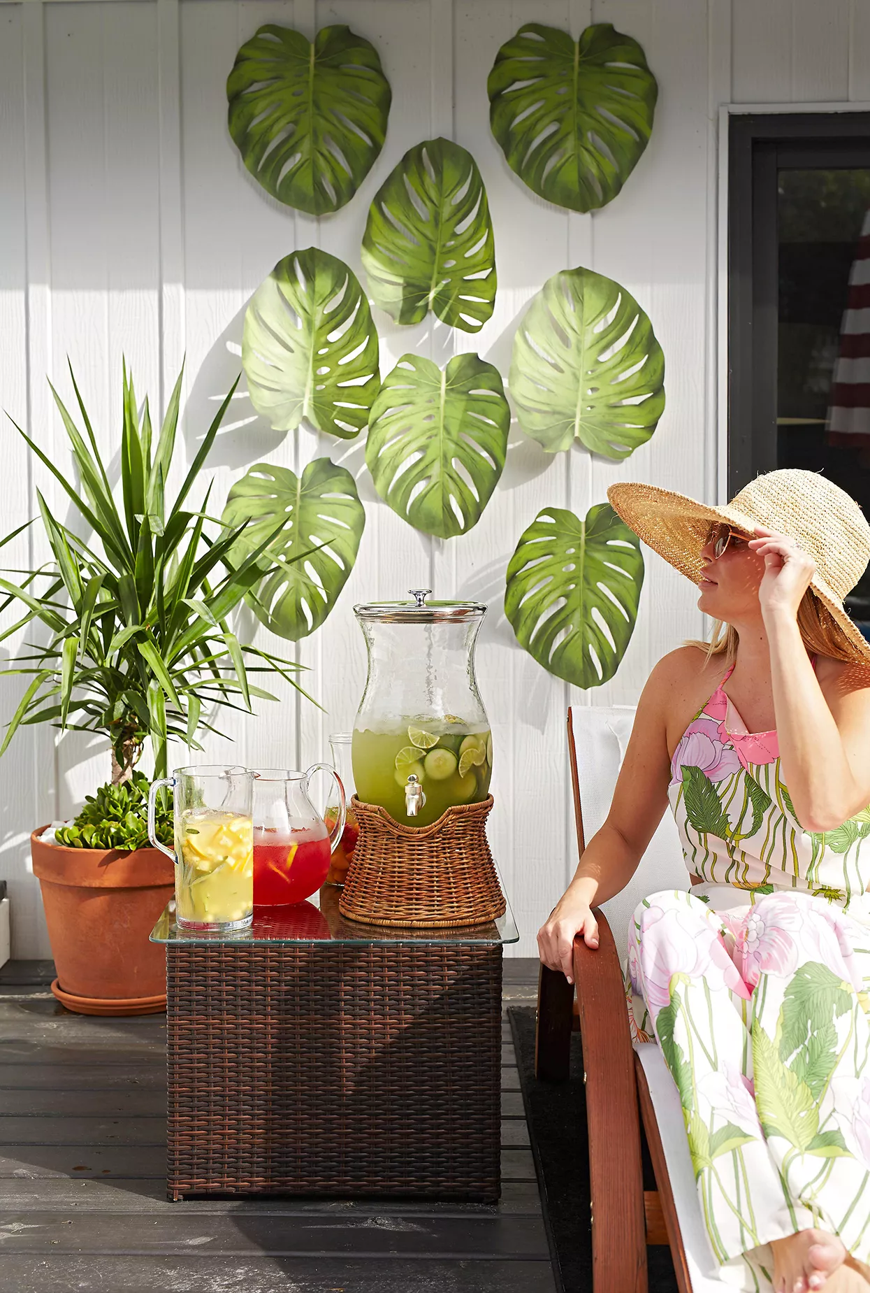 woman on lounge chair near summer drinks