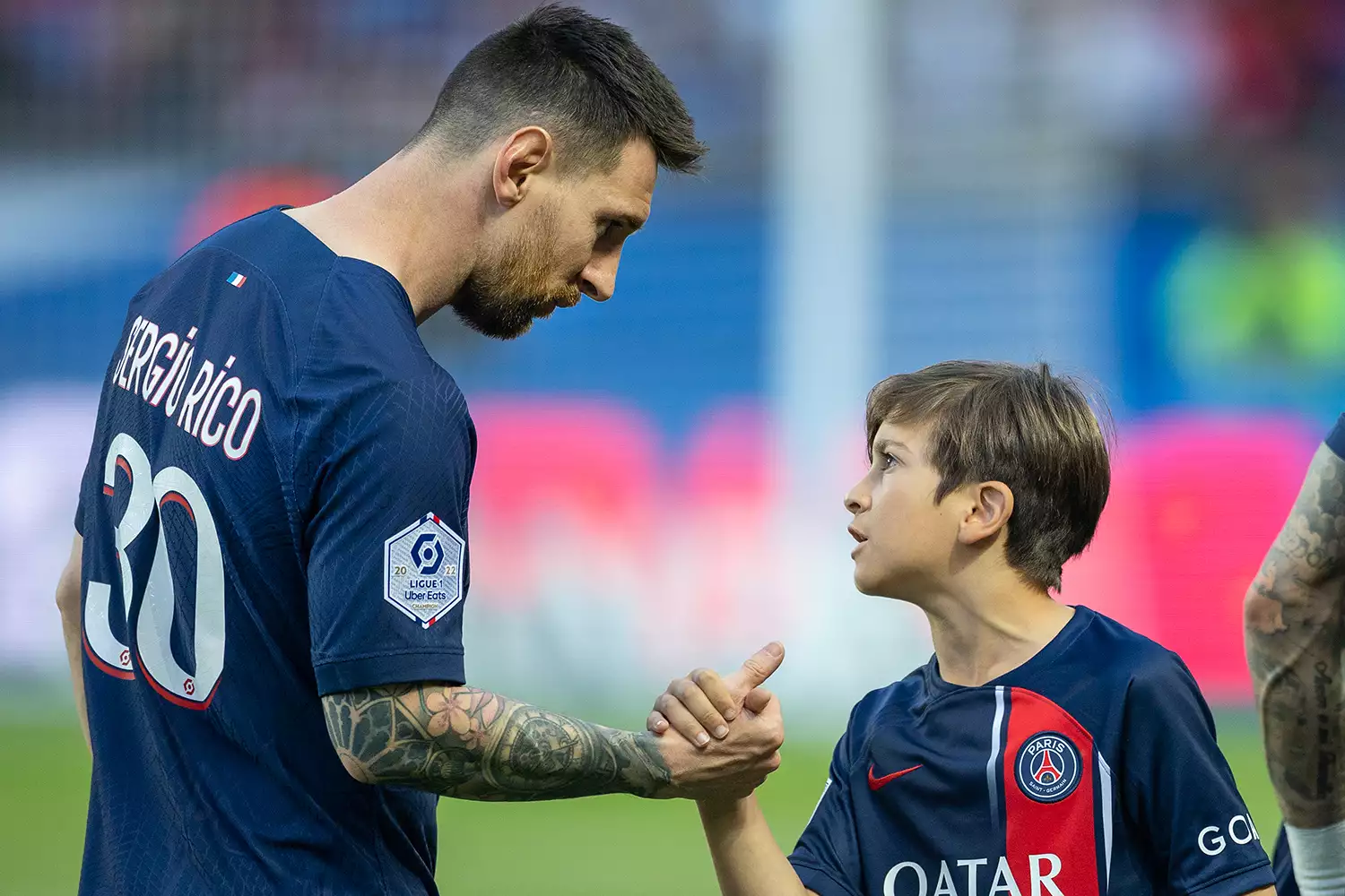 Lionel Messi #30 of Paris Saint-Germain with his eldest son Thiago after the player's children accompanied them for pre-match presentations before the Paris Saint-Germain V Clermont, French Ligue 1 regular season match at Parc des Princes on June 3, 2023, in Paris, France 